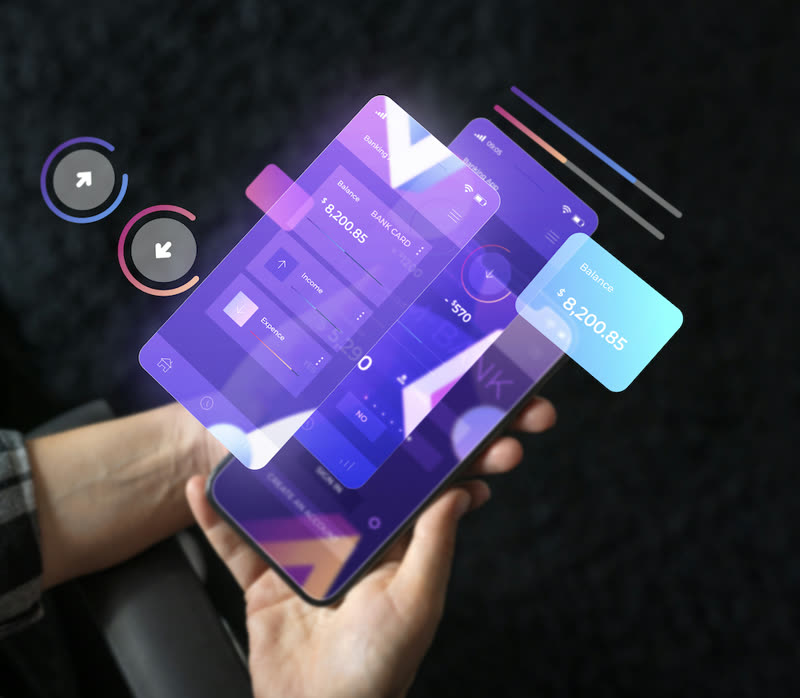 Hand holding a phone with floating banking balance screens
