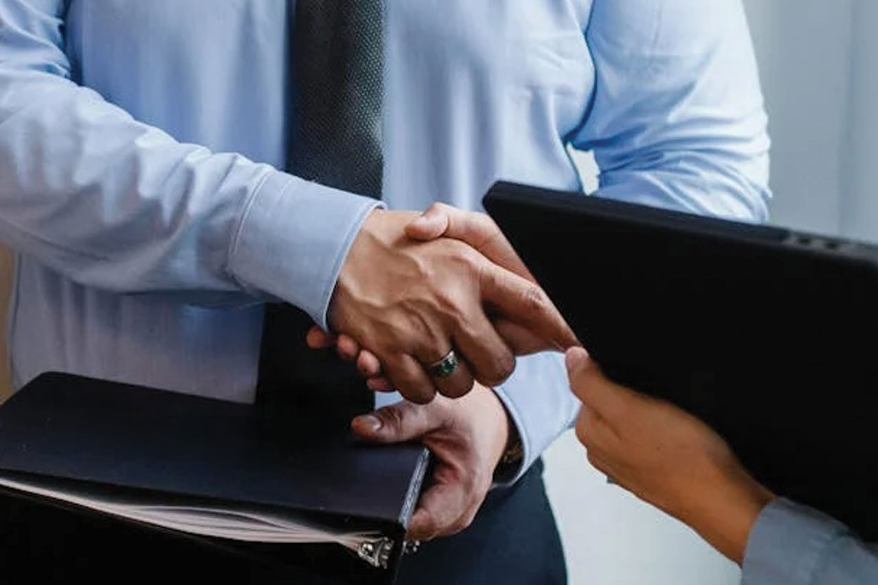 Two business people shaking hands